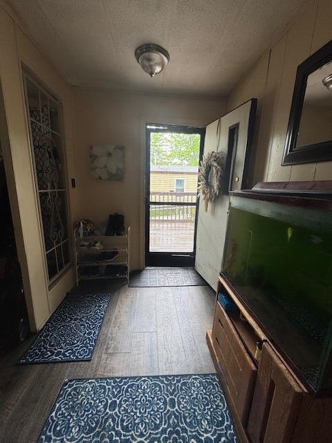 583 S Mcintosh Ln, Muskegon, MI 49442 - doorway featuring wood finished floors and a textured ceiling