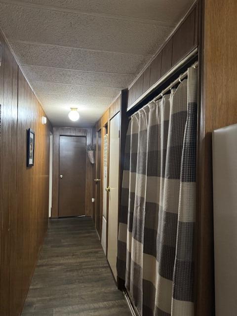 583 S Mcintosh Ln, Muskegon, MI 49442 - hall with dark wood finished floors and wooden walls