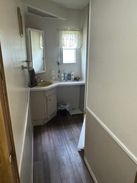 583 S Mcintosh Ln, Muskegon, MI 49442 - bathroom featuring vanity and hardwood / wood-style floors