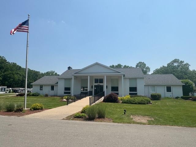 583 S Mcintosh Ln, Muskegon, MI 49442 - view of front of house with a front lawn