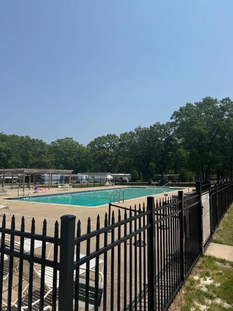 583 S Mcintosh Ln, Muskegon, MI 49442 - community pool with a patio area