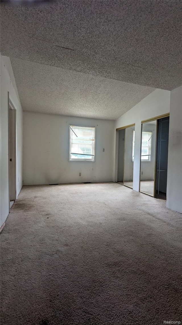 551 Nebraska Ave, Pontiac, MI 48341 - carpeted spare room featuring healthy amount of natural light and a textured ceiling