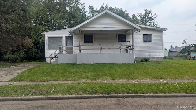 551 Nebraska Ave, Pontiac, MI 48341 - view of front facade featuring a front lawn and covered porch