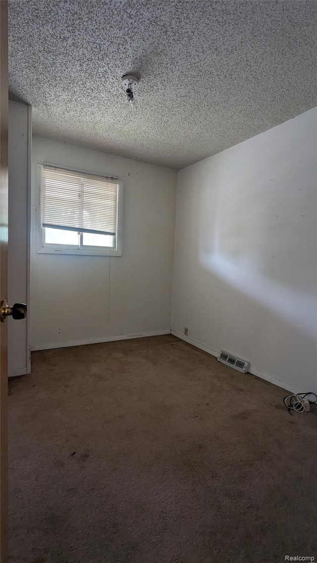 551 Nebraska Ave, Pontiac, MI 48341 - carpeted empty room featuring a textured ceiling and baseboards