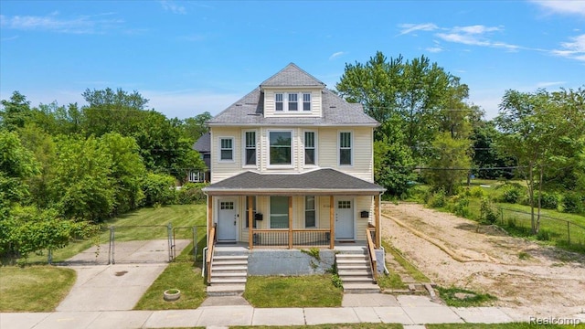 2160 Concord St, Detroit, MI 48207 - american foursquare style home with a porch and a gate