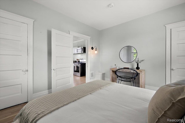 2160 Concord St, Detroit, MI 48207 - bedroom featuring wood finished floors and baseboards