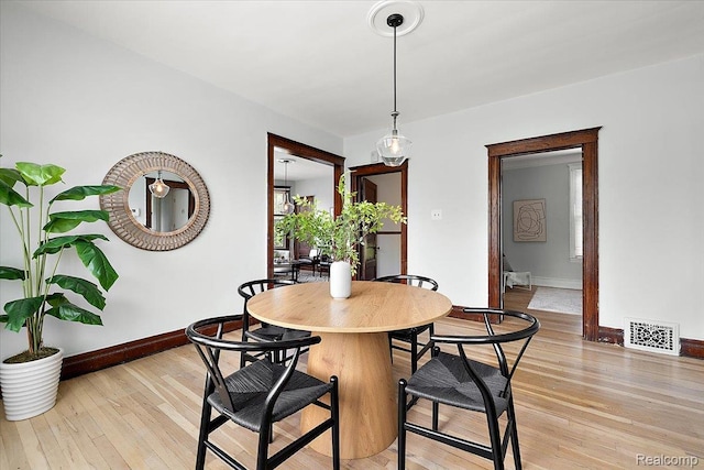 2160 Concord St, Detroit, MI 48207 - dining area featuring baseboards and light wood-style floors