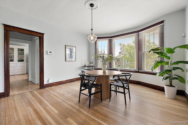 2160 Concord St, Detroit, MI 48207 - dining space with healthy amount of natural light and light wood-style floors