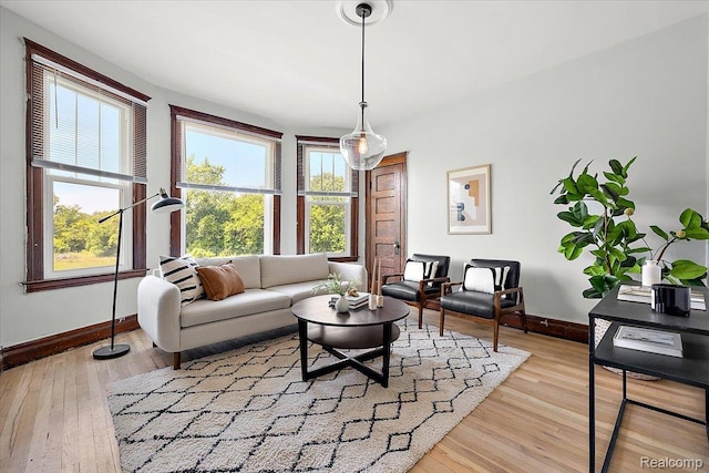 2160 Concord St, Detroit, MI 48207 - living room featuring healthy amount of natural light and light wood finished floors