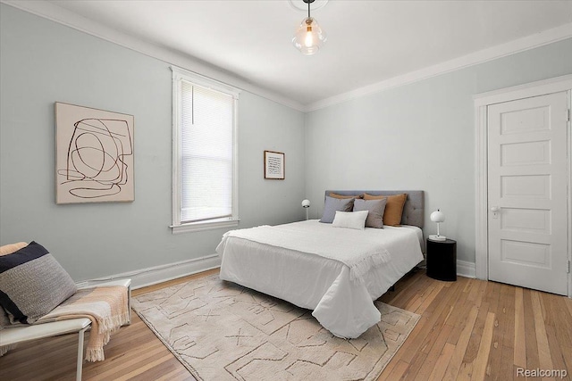 2160 Concord St, Detroit, MI 48207 - bedroom with light wood finished floors and ornamental molding
