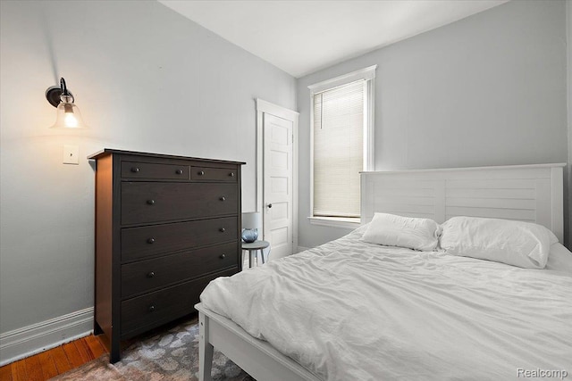 2160 Concord St, Detroit, MI 48207 - bedroom with dark wood-style floors and baseboards