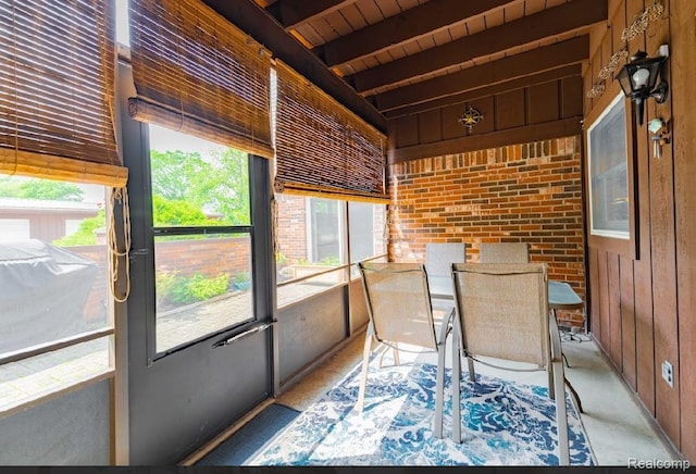 8597 Mathias Dr # 37, Grosse Ile, MI 48138 - unfurnished sunroom with beamed ceiling and outdoor dining space