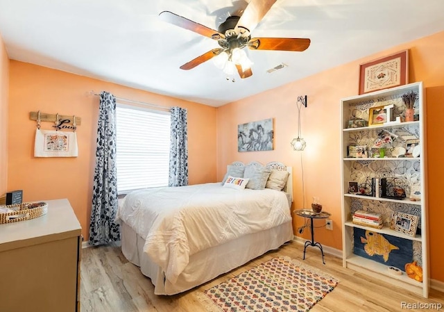 8597 Mathias Dr # 37, Grosse Ile, MI 48138 - bedroom featuring light wood finished floors and a ceiling fan