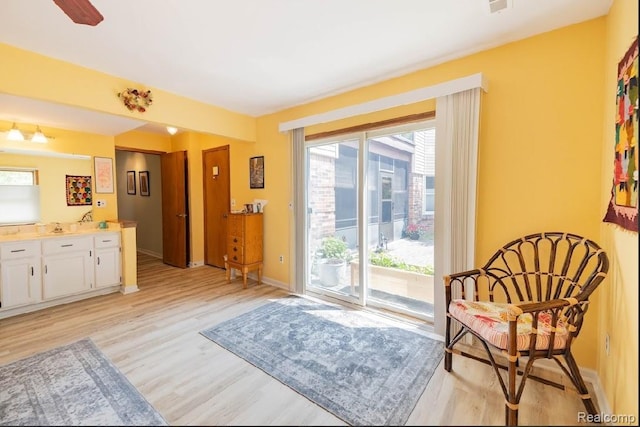 8597 Mathias Dr # 37, Grosse Ile, MI 48138 - sitting room featuring light wood finished floors and baseboards