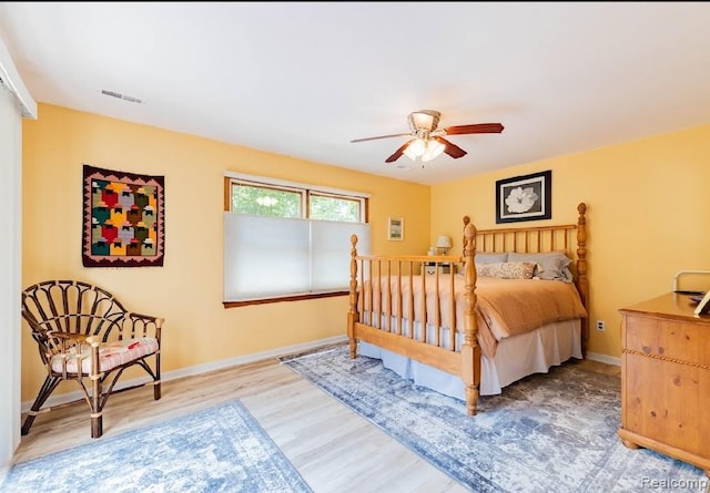 8597 Mathias Dr # 37, Grosse Ile, MI 48138 - bedroom featuring light wood finished floors, baseboards, and ceiling fan