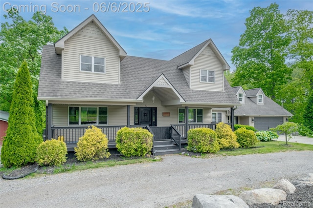 12631 9 Mile Rd, South Lyon, MI 48178 - view of front of house with a porch, roof with shingles, and a garage