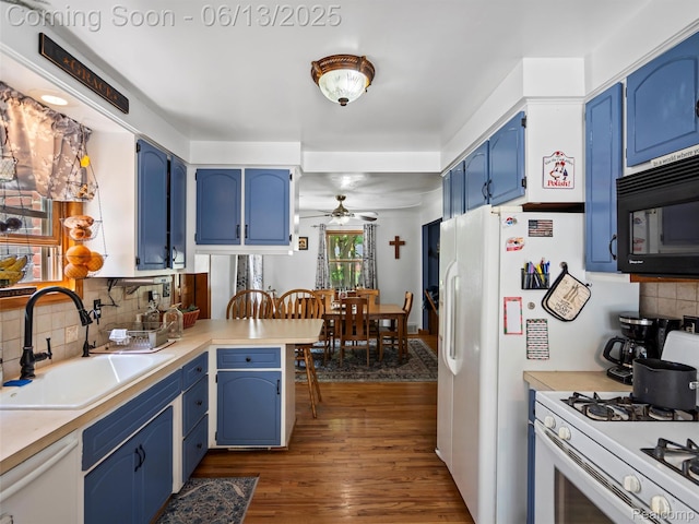27904 Milton Ave, Warren, MI 48092 - kitchen featuring white appliances, blue cabinetry, ceiling fan, dark wood-type flooring, and a peninsula