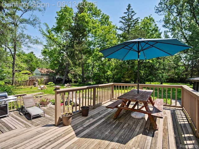 27904 Milton Ave, Warren, MI 48092 - deck featuring grilling area, a fenced backyard, view of scattered trees, and outdoor dining space