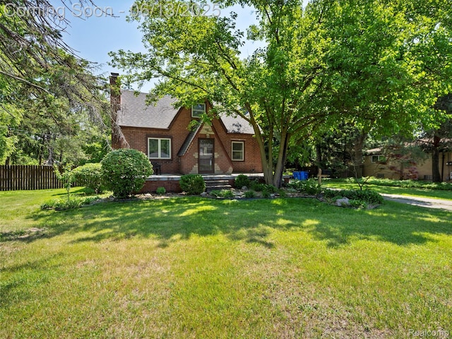 27904 Milton Ave, Warren, MI 48092 - view of front of property featuring brick siding, a chimney, and roof with shingles