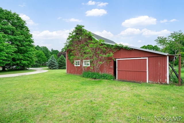 6810 Pierce St, Allendale, MI 49401 - view of home's exterior with a yard, an outbuilding, and a garage