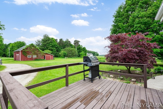 6810 Pierce St, Allendale, MI 49401 - wooden deck with grilling area, an outdoor structure, and a yard