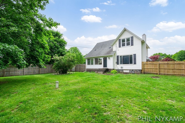 6810 Pierce St, Allendale, MI 49401 - rear view of house with a chimney and entry steps