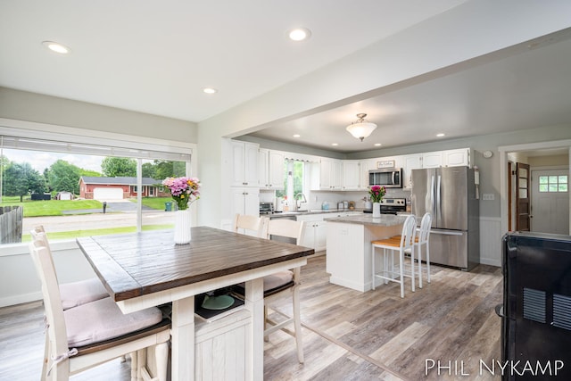 6810 Pierce St, Allendale, MI 49401 - kitchen featuring appliances with stainless steel finishes, a kitchen island, white cabinets, recessed lighting, and light countertops