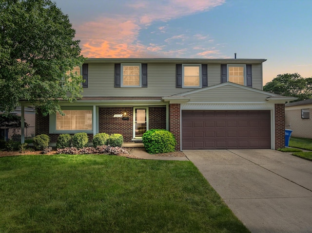 3604 Pall Dr, Warren, MI 48092 - traditional home featuring an attached garage, brick siding, and concrete driveway