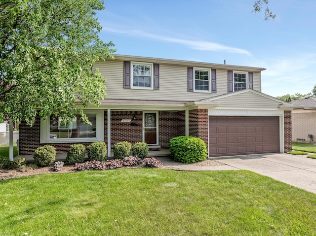 3604 Pall Dr, Warren, MI 48092 - traditional-style home featuring driveway, brick siding, a front yard, and a garage