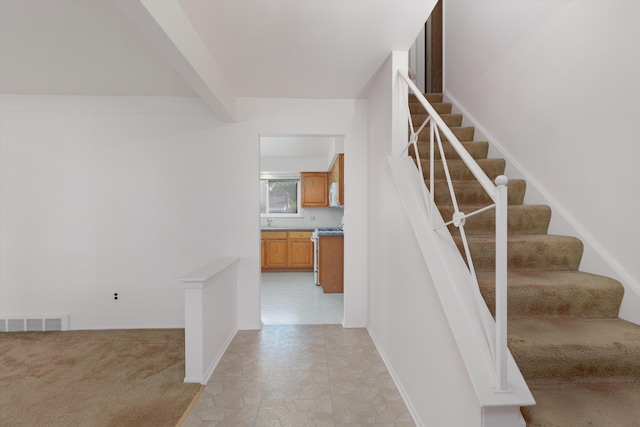 3604 Pall Dr, Warren, MI 48092 - stairs featuring stone finish floors