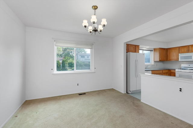 3604 Pall Dr, Warren, MI 48092 - kitchen with white appliances, light colored carpet, healthy amount of natural light, and a chandelier