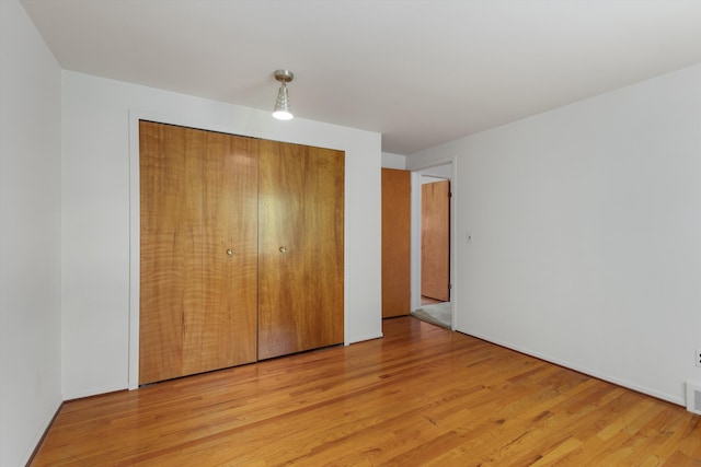 3604 Pall Dr, Warren, MI 48092 - unfurnished bedroom featuring light wood-type flooring and a closet