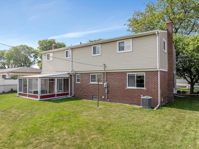 3604 Pall Dr, Warren, MI 48092 - rear view of house with a chimney, a sunroom, and brick siding