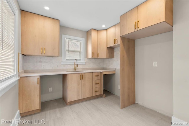 16810 Archdale St, Detroit, MI 48235 - kitchen with a sink, light brown cabinets, backsplash, light flooring, and light countertops