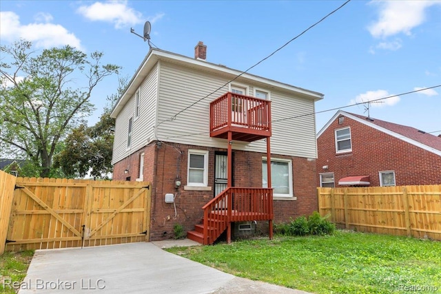 16810 Archdale St, Detroit, MI 48235 - back of house with a balcony, a gate, brick siding, and a chimney