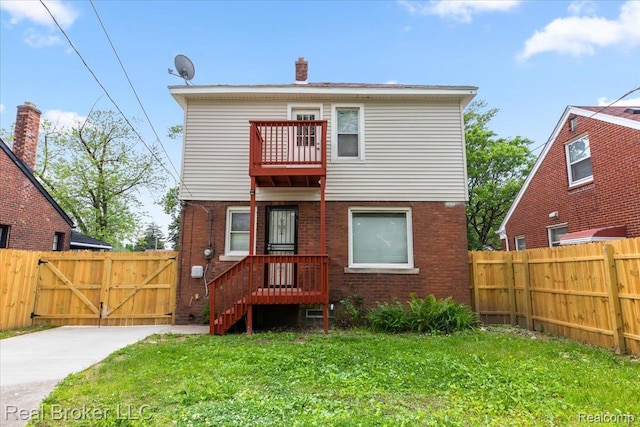 16810 Archdale St, Detroit, MI 48235 - rear view of property with a balcony, brick siding, a gate, and a chimney