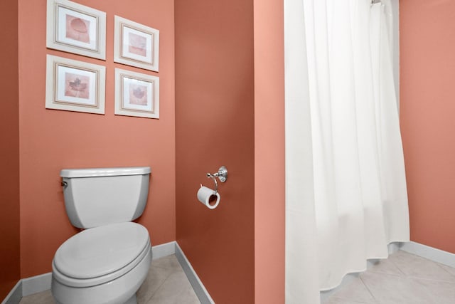 6286 Red Fox Run, Traverse City, MI 49686 - bathroom featuring toilet, tile patterned floors, and baseboards