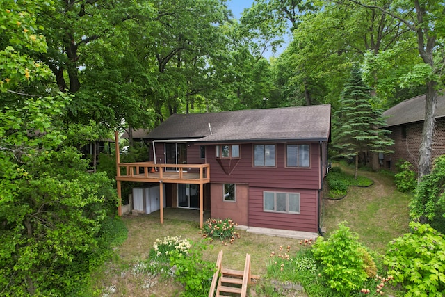 1931 Charlotte Landing Rd, Springport, MI 49284 - back of house with a wooden deck and a shingled roof