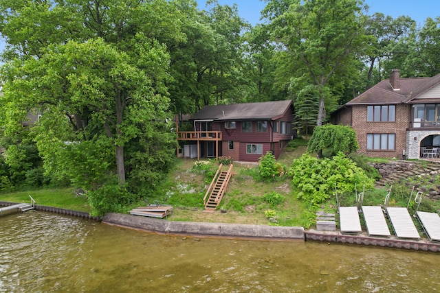 1931 Charlotte Landing Rd, Springport, MI 49284 - back of property featuring stairway and a deck with water view