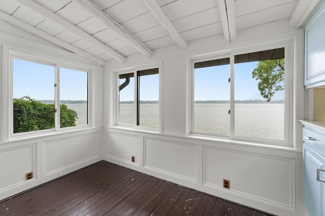 1931 Charlotte Landing Rd, Springport, MI 49284 - unfurnished sunroom with wood-type flooring, a water view, healthy amount of natural light, and a decorative wall