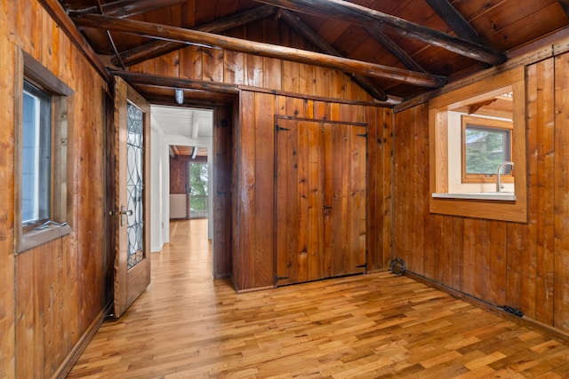 1931 Charlotte Landing Rd, Springport, MI 49284 - empty room featuring wooden walls, wood finished floors, plenty of natural light, and wooden ceiling