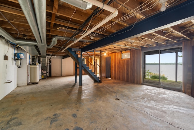 1931 Charlotte Landing Rd, Springport, MI 49284 - basement with stairs, gas water heater, and heating unit