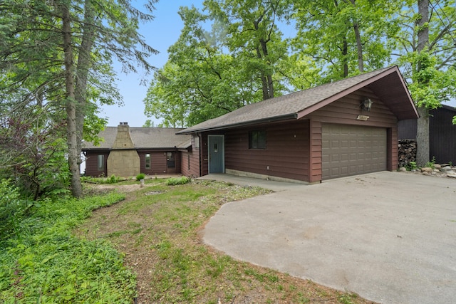1931 Charlotte Landing Rd, Springport, MI 49284 - view of front of house with a shingled roof and a detached garage