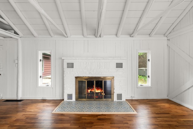 1931 Charlotte Landing Rd, Springport, MI 49284 - unfurnished living room featuring hardwood / wood-style flooring and a fireplace with flush hearth