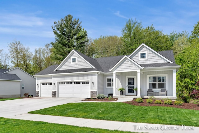 16371 Wickshire Pl, Spring Lake, MI 49456 - view of front facade featuring board and batten siding, a garage, concrete driveway, a front yard, and covered porch