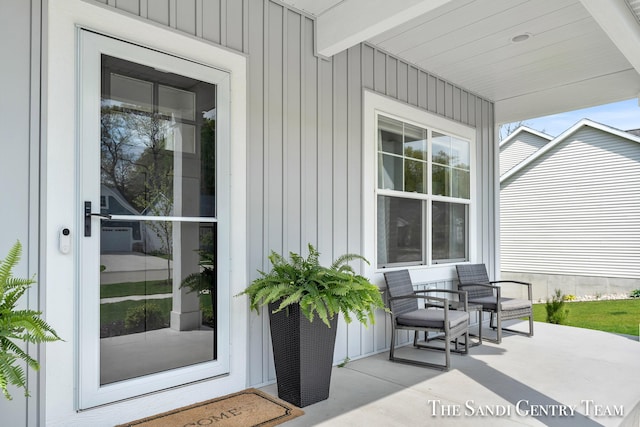 16371 Wickshire Pl, Spring Lake, MI 49456 - doorway to property featuring a porch and board and batten siding