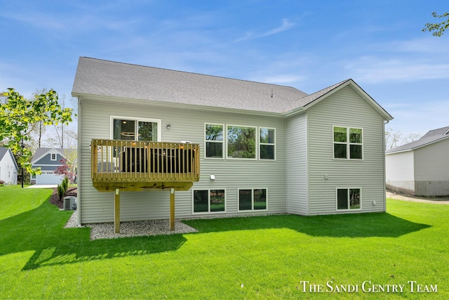 16371 Wickshire Pl, Spring Lake, MI 49456 - rear view of property featuring a lawn, central air condition unit, and roof with shingles