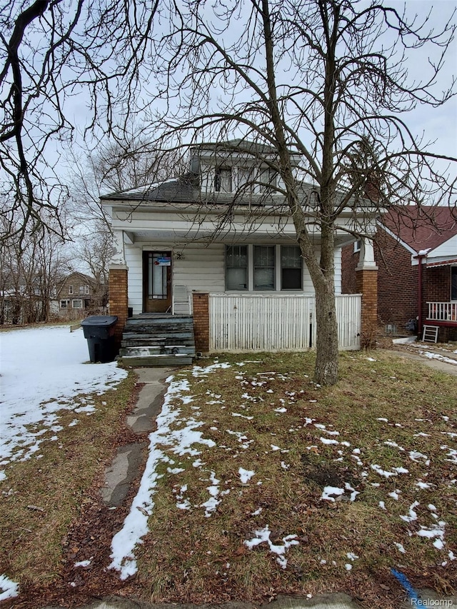 18430 Westphalia St, Detroit, MI 48205 - bungalow-style house with covered porch and brick siding