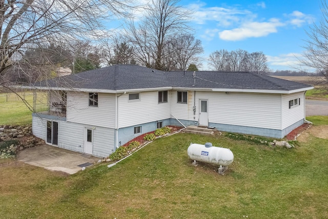 13405 Ellis Rd, Conklin, MI 49403 - rear view of property with a patio, a yard, and a shingled roof