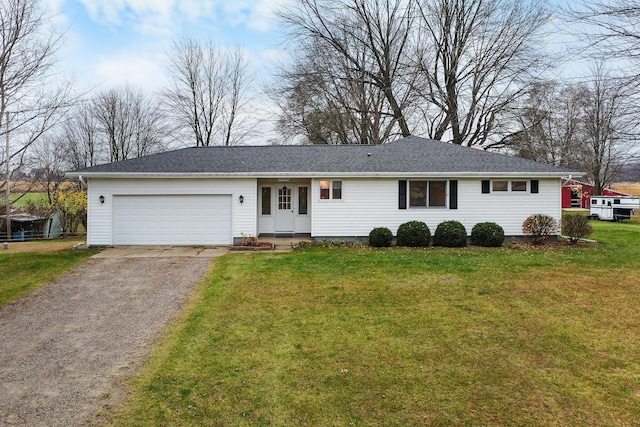 13405 Ellis Rd, Conklin, MI 49403 - single story home featuring asphalt driveway, a garage, and a front yard